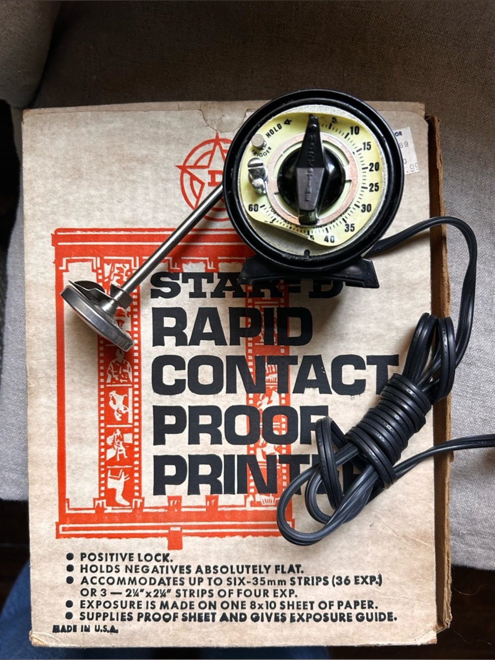 Vintage film developing accessories: timer, thermometer, proof printer box.